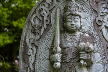 A religious stone statue of Akasagarbha at Japanese buddhism temple