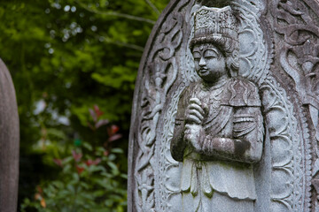 A religious stone statue of Dainichi Nyorai at Japanese buddhism temple