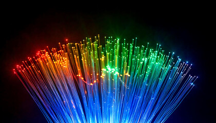 Vibrant multicolored optical fibers illuminate a dark background, creating a stunning visual effect perfect for technology, communication, or abstract design projects.  The dynamic light trails and