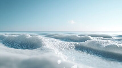 Obraz premium Frothy ocean waves on a sunny beach; serene seascape for travel brochures.