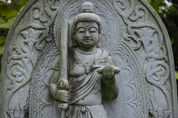 A religious stone statue of Manjusri at Japanese buddhism temple