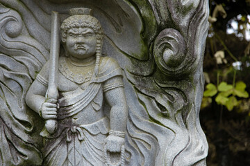 A religious stone statue of Acala at Japanese buddhism temple