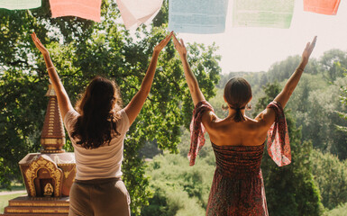 Close up of female mentor and student before Mindful meditation and yoga in the gazebo....