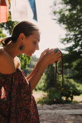 Woman practicing yoga and meditation in a Buddhist temple, relaxed with closed eyes. Mindful...