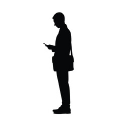 Silhouette of a businessman or employee with a briefcase while using a cell phone