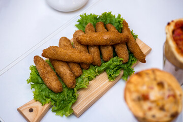 fried chicken with cheese served in the restaurant .nuggets