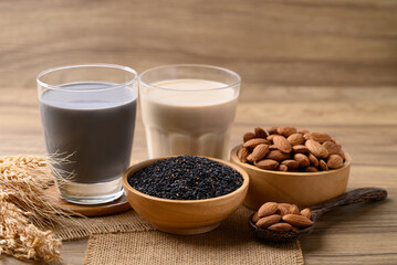 Alternative milk made from plant on wooden background, non dairy, Vegan food