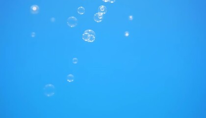 Floating Bubbles Against a Vivid Blue Sky: A Serene, Airy Image
