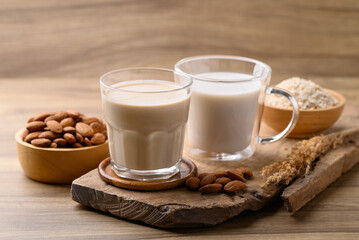 Alternative milk made from plant on wooden background, non dairy, Vegan food
