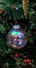 Christmas toys on an artificial Christmas tree close-up
