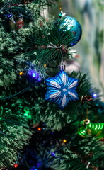 Christmas toys on an artificial Christmas tree close-up