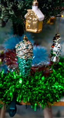 Christmas toys on an artificial Christmas tree close-up