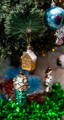 Christmas toys on an artificial Christmas tree close-up