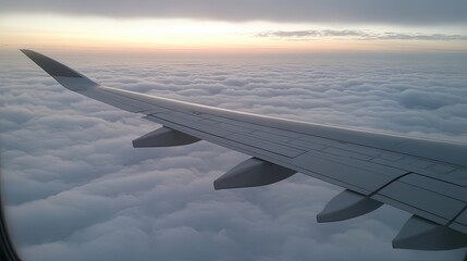 Obraz premium Flying above fluffy clouds during sunset while enjoying a serene journey in the sky