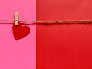 Abstract Concept - Red heart hanging on the rope with copy space background. Valentine's Day.