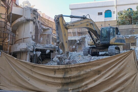 Old low-rise building under demolition in Dubai, showcasing urban redevelopment and renewal processes of city property landscape in the city.  - Powered by Adobe