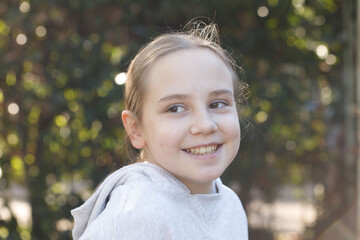 Cheerful child smiling, outdoors portrait. Happiness and childhood concept