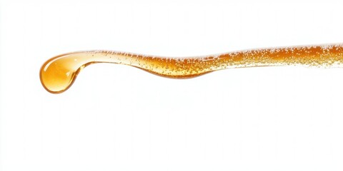 Naklejka premium Honey dripping from dipper on white background