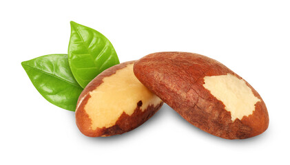 Brazil nuts and green leaves isolated on white