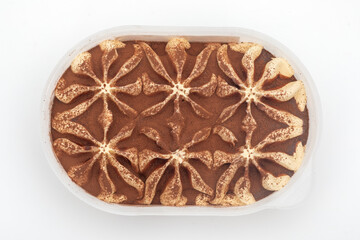 Tiramisu Ice Cream in Plastic Container on White Background – Elegant Frozen Dessert Image