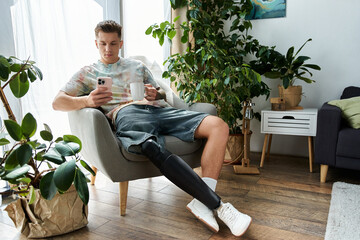 Obraz premium Handsome young man enjoying a peaceful moment at home with a prosthetic leg