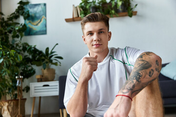 Young man with prosthetic leg smiles confidently in a bright living room showcasing personal style