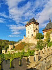 A view of the medieval castle Karlstejn. The walls and forests around.