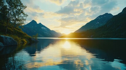 Serene Sunrise Over Calm Lake Surrounded by Majestic Mountains