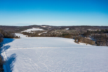 Obraz premium A bird's eye view of the snowy winter landscape in the Taunus