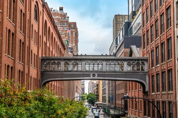 A view towards a walkway between buildings from the High Line walkway in Manhattan, New York, in the fall