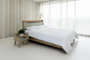 The comfortable bedroom in minimal style with clear light from glass window