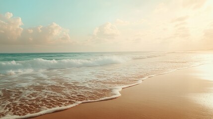 Obraz premium A serene beachscape with gentle waves and untouched sand, radiating peace and tranquility under a glowing sky