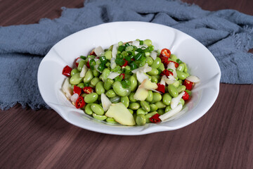 Boiled edamame on a white plate