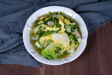 Stir-fried vegetable cabbage on a white plate