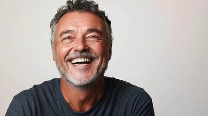 Fototapeta premium Happy Mature Man with Graying Hair and Beard Smiles