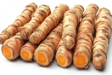 Fresh turmeric roots displayed, showcasing their vibrant orange interior.