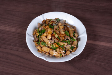 Shredded pork with green pepper and dried beans on a plate