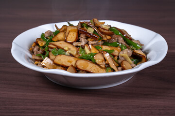 Shredded pork with green pepper and dried beans on a plate