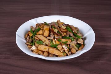 Shredded pork with green pepper and dried beans on a plate