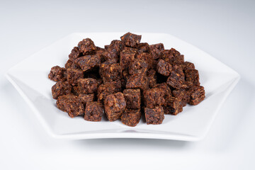 Cubes of spicy beef jerky