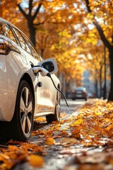 White Electric Car Charging on an Autumn Street, Embracing Sustainable Transportation in Fall Colors