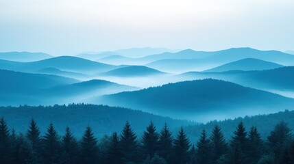 Obraz premium A serene landscape of rolling blue hills and misty forests at dawn.