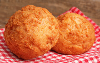 choux pastries on red paper
