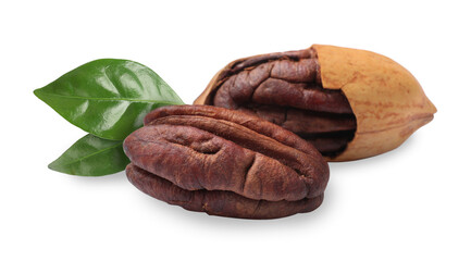 Tasty pecan nuts and green leaves isolated on white