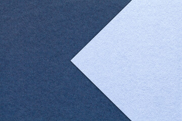 Texture navy blue paper background, half two colors with denim arrow, macro. Structure very peri...