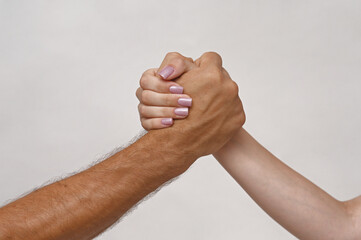 male and female hands. gesture of a strife or solidarity, white background. concept
