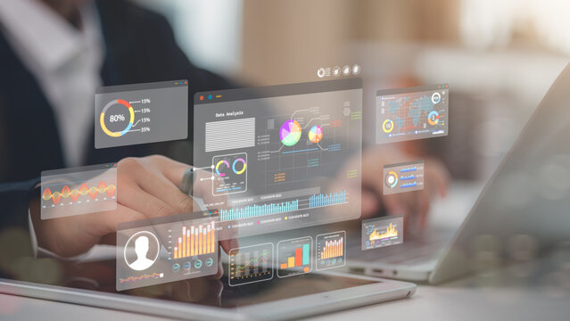 An analyst uses a computer and dashboard for data business analysis and a Data Management System with KPI and metrics connected to the database for technology finance, operations, sales, marketing - Powered by Adobe