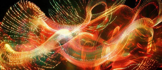 Abstract glowing orange and green light streaks, swirling and dynamic motion.