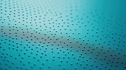 Teal perforated surface with subtle texture and light reflection.