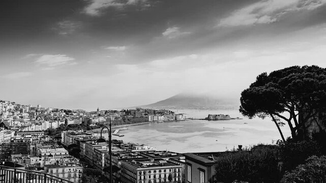 Naples, Italy. Panoramic view from Sant'Antonio to Posillipo of the Gulf of Naples. Mergellina, Castel dell'Ovo, the Lungomare and Viale Gramsci seen from above. Black and white Time Lapse video.